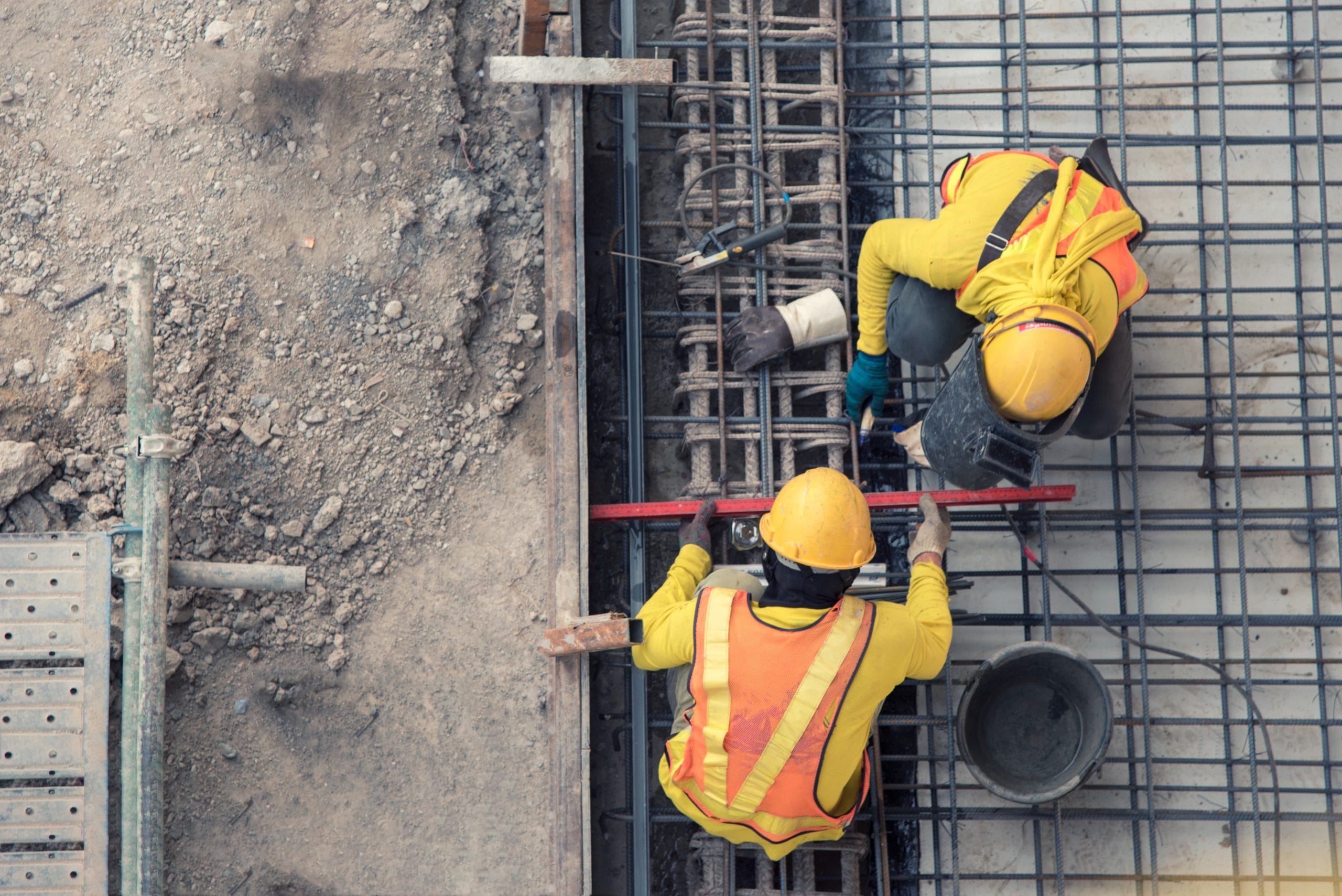 An aerial view of construction workers on-site