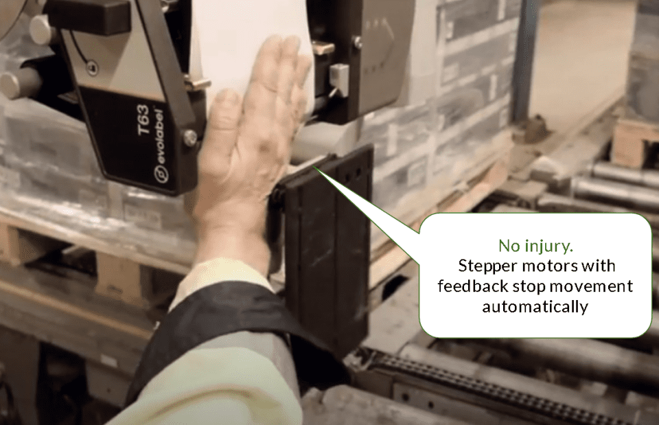A person puts their hand near a T63 unit. There's a speech bubble saying: "No injury. Stepper motors with feedback stop movement automatically"