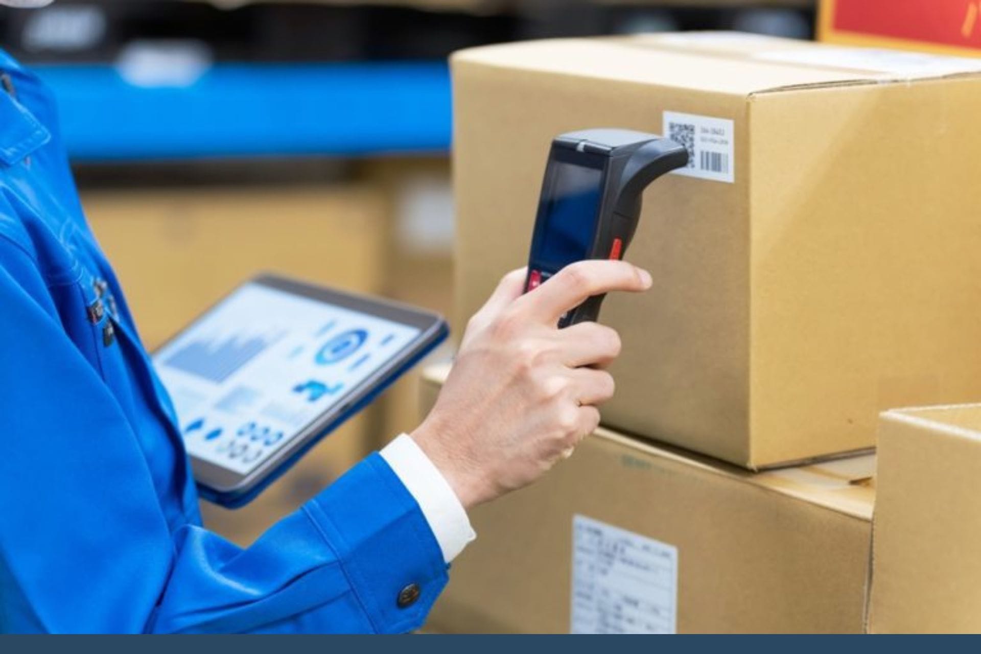 person scanning a barcode label on a cardboard box