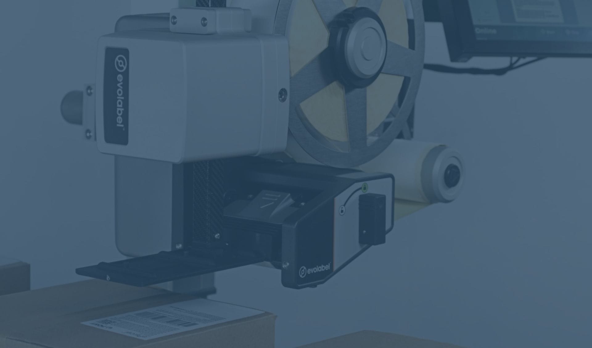 Evolabel applicator applying a label to a cardboard box