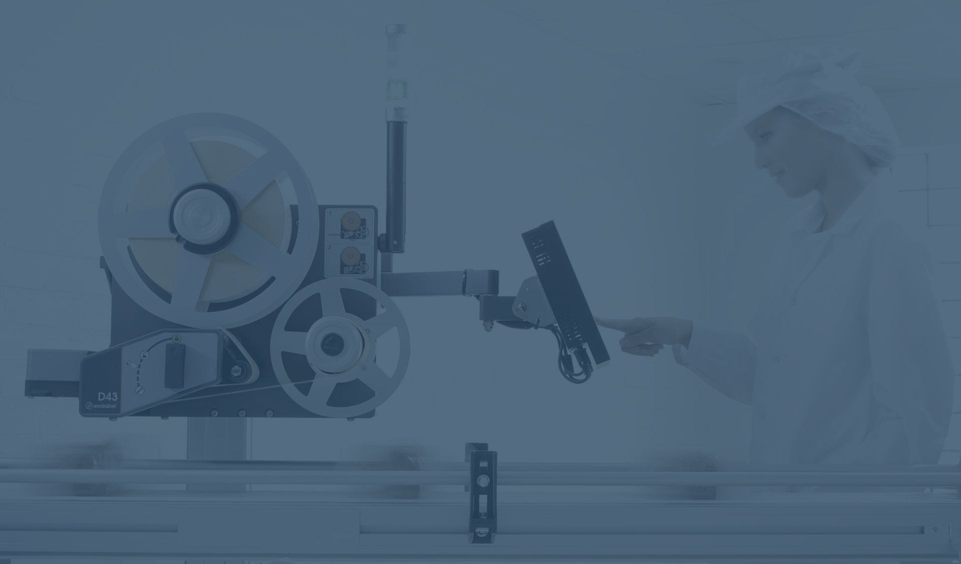 Person operating an Evolabel D43 label applicator