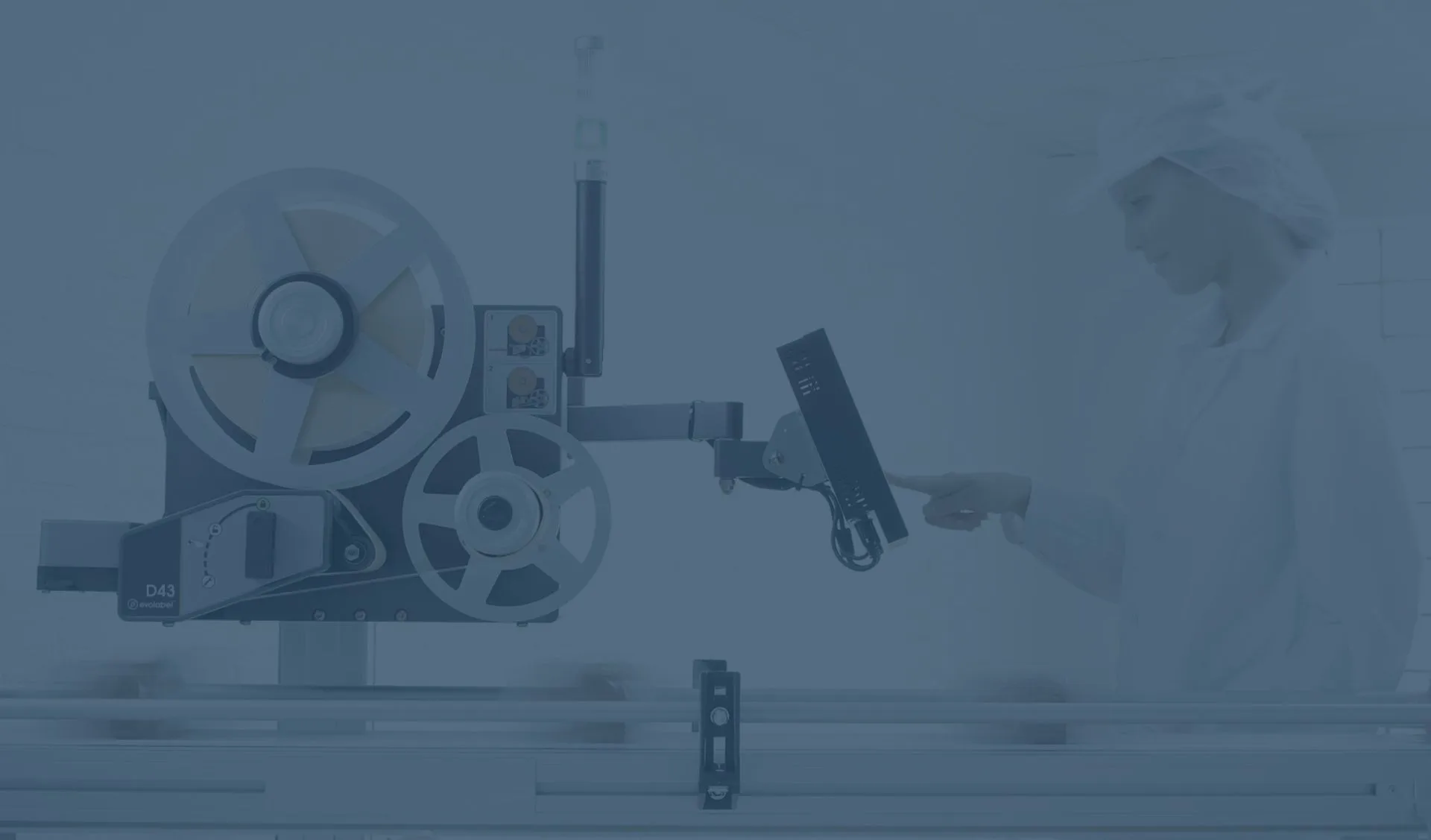 Person operating an Evolabel D43 label applicator