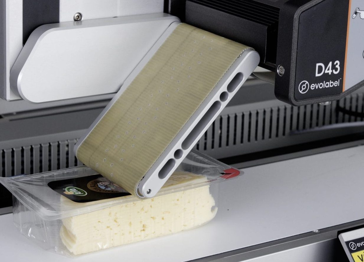 Belt-applicator-2-1536x948 Evolabel belt applicator applying label to a food item
