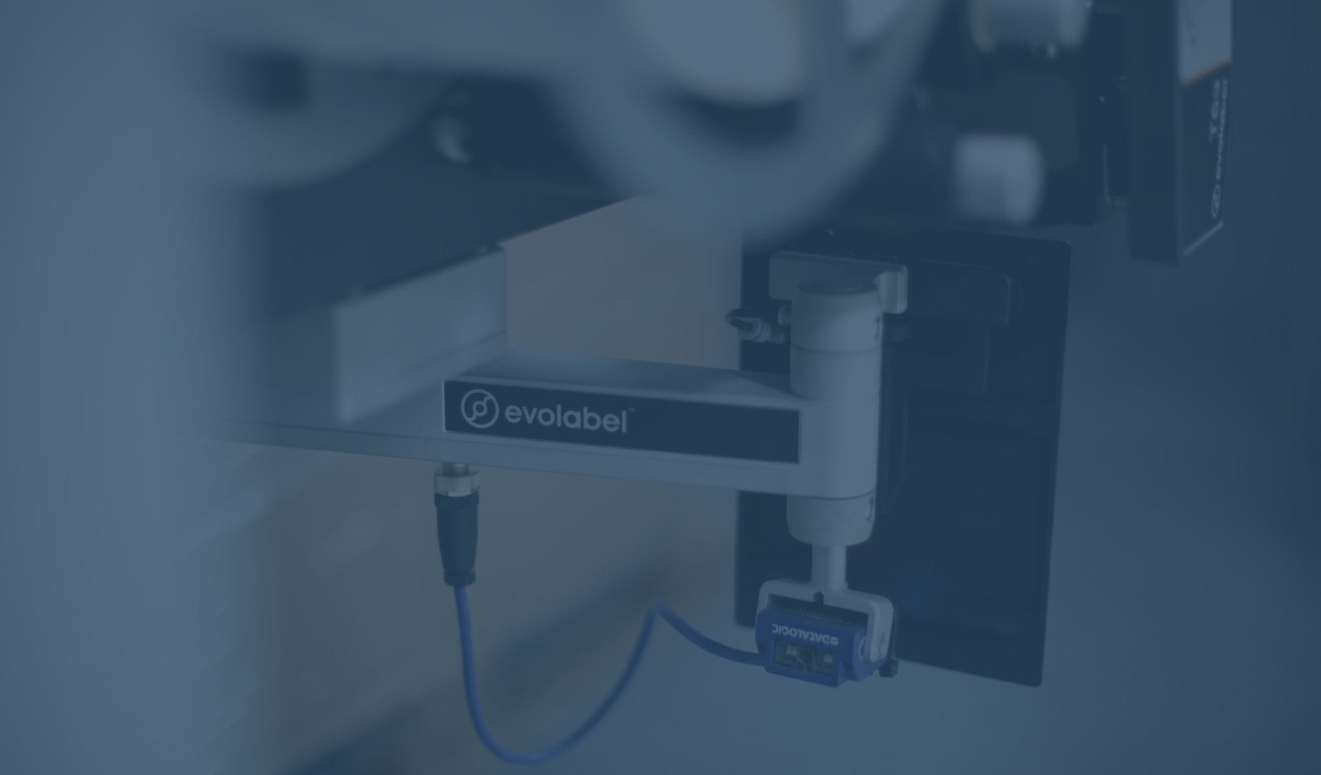 Close up of the applicator arm on an Evolabel thermal transfer printer (T63)