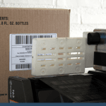 blowvac label applicator applying a label to a cardboard box